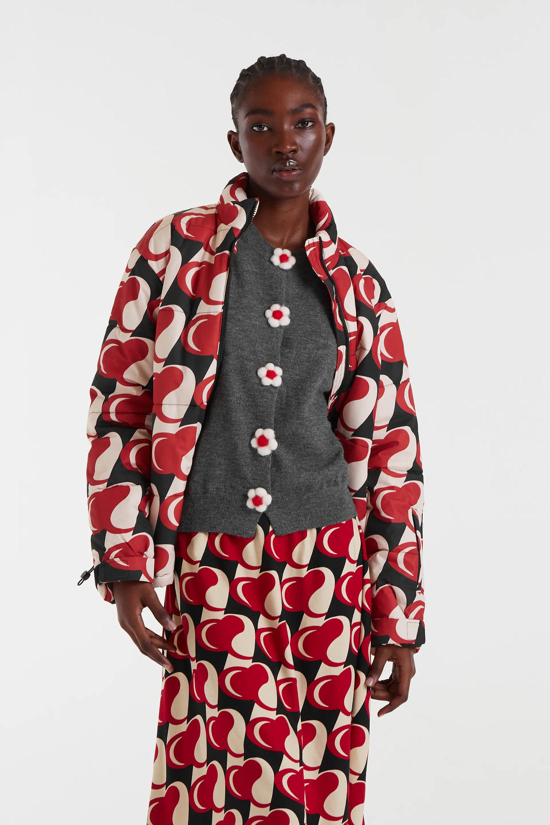 Cárdigan de punto fino botón flor