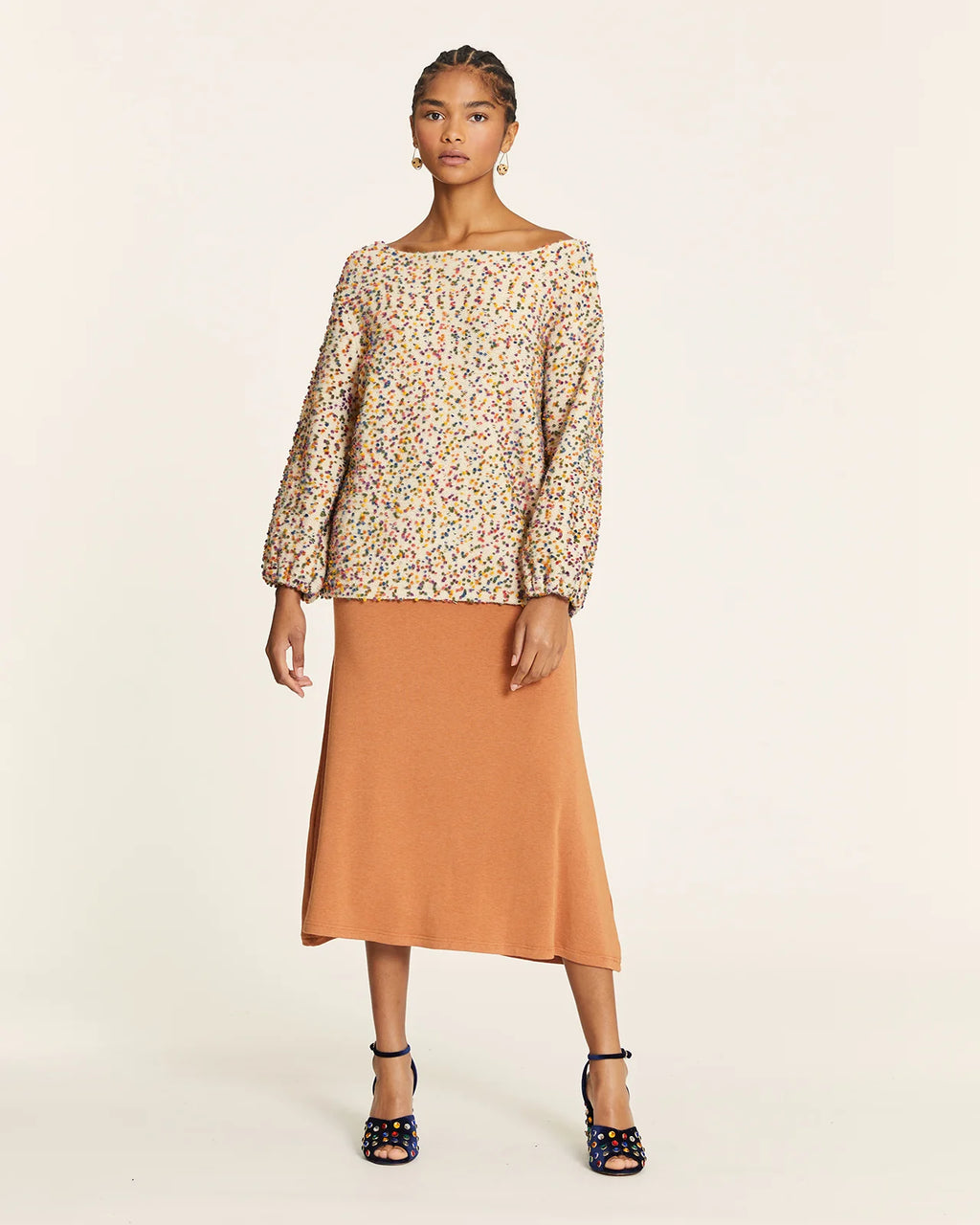 Jersey punto mini pompones crudo