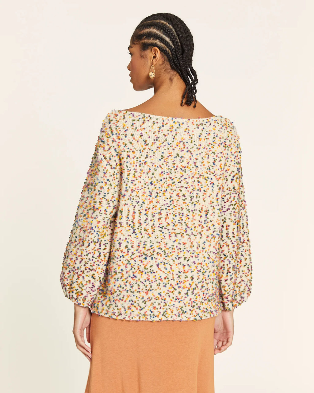 Jersey punto mini pompones crudo