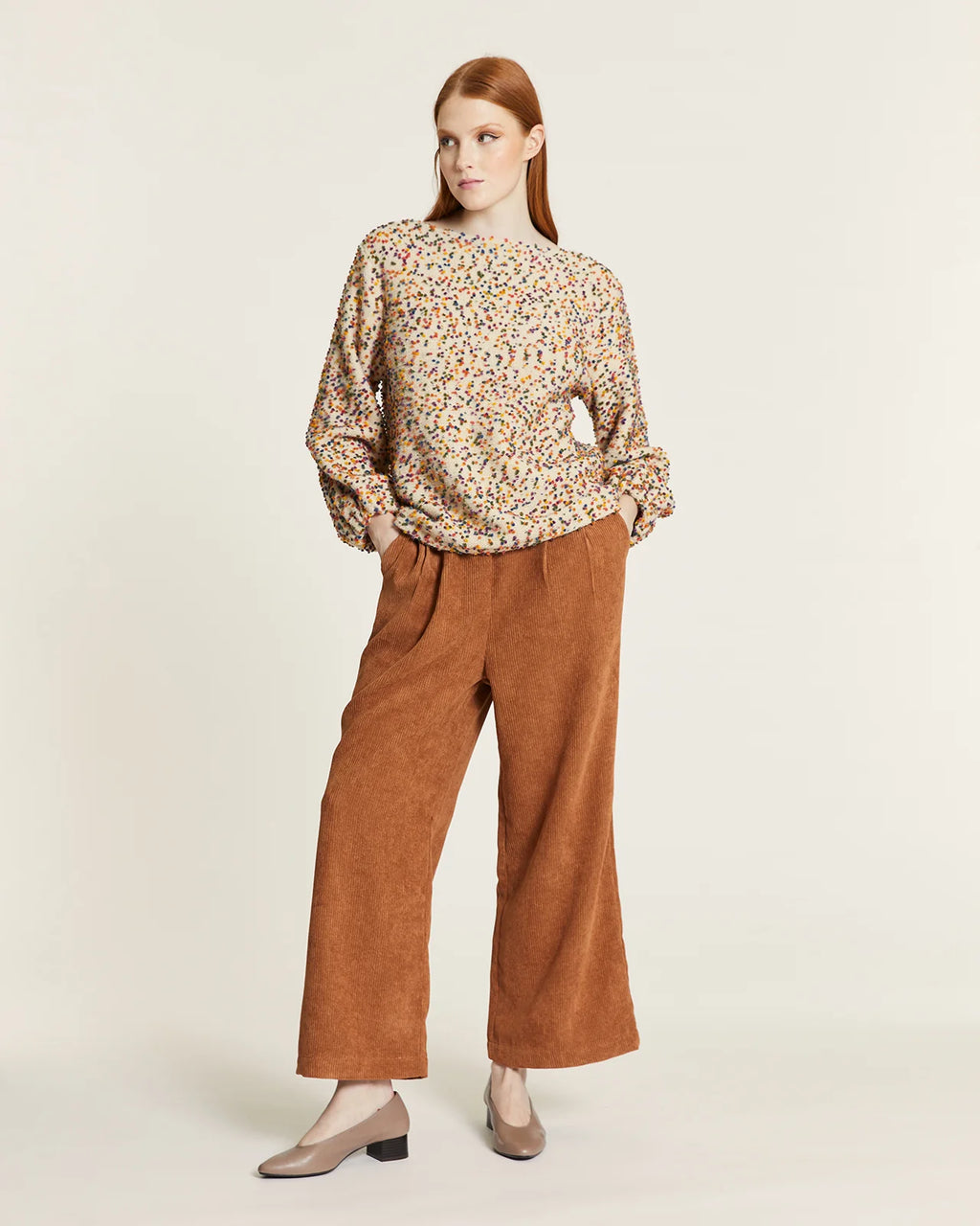 Jersey punto mini pompones crudo