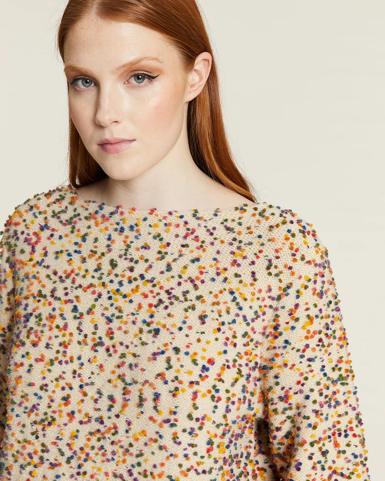 Jersey punto mini pompones crudo